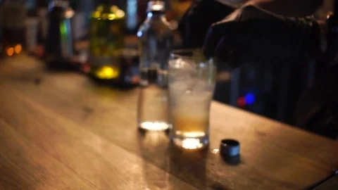 Professional bartender preparing a cocktail 動画素材 104523211