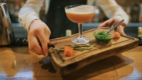 A professional bartender preparing a cocktail with ice a mix of alcohol Stock Footage 88549886