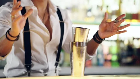Professional bartender preparing a cocktail using a shaker Stock Footage 337885347