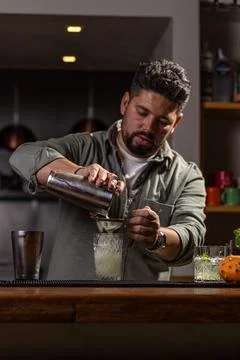 Professional bartender preparing a drink Stock Photos