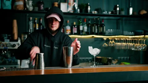 A professional bartender takes a shaker in his hands The process of making Stock Footage 240441635