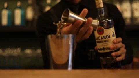 Professional Bartender Using Jigger to Make Drink Stock Footage 129782283