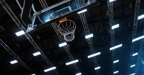 Professional basketball player in action performing slam dunk Stock Footage 119970178