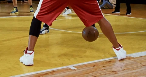 Professional basketball player in action performing slam dunk Stock Footage 119976519