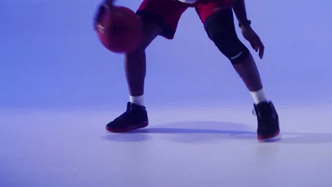 Professional basketball player on blue background. African american man playing Video stock 163846071