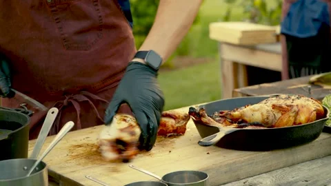 Professional BBQ Chef Slicing Whole Roasted Chicken Stock Footage 326004054