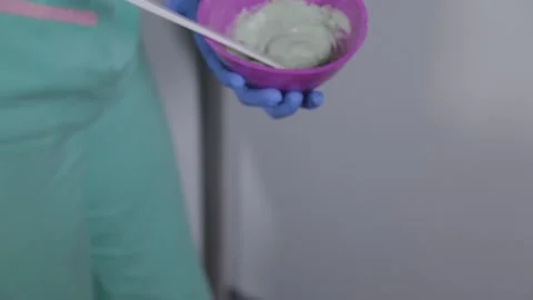 Professional beautician changes face mask. Stock Footage 133232386