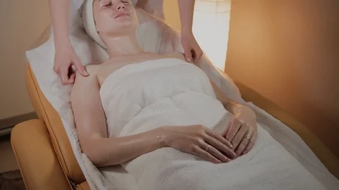 Professional beautician makes a complex massage to a young girl in the 库存影片 109896313
