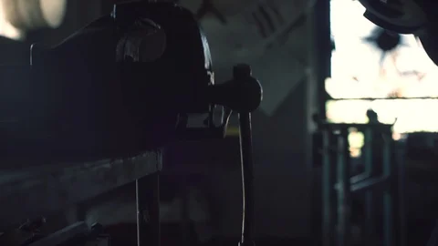 Professional blacksmith using an angle grinder Stock Footage 128597680