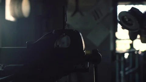 Professional blacksmith using an angle grinder Stock Footage 128597686