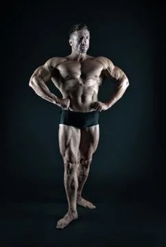 Professional bodybuilder. Bodybuilder black background. Fit bodybuilder show Stock Photos