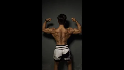Professional-Bodybuilder-Posing-with-Powerful-Physique Stock Footage 328907845