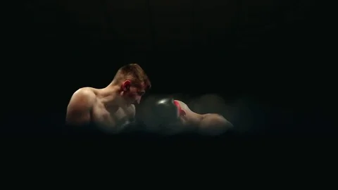Professional boxers on the rig are exchanging strong blows to the head. Camera Stock Footage 83800849