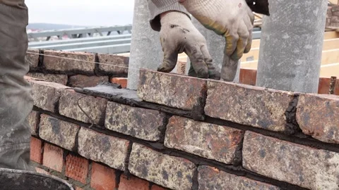 Professional bricklayer building a brick wall Stock Footage 331950884