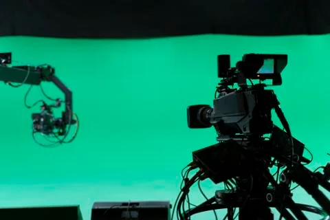 Professional Broadcast studio camera on crane and camera in virtual green stu Stock Photos
