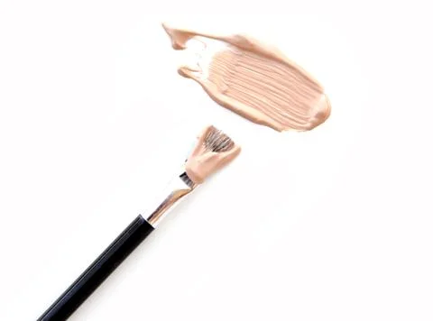 Professional brush and foundation sample on white Stock Photos