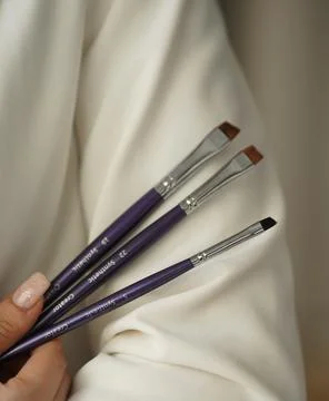 Professional brushes for brows closeup on isolated white background Stock Photos