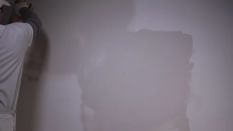 Professional Builder With Spatula Applies Plaster To The Wall Stock Footage 101382874