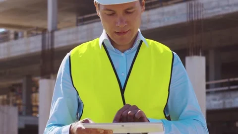 Professional builder standing in front of construction site. Foreman in hardhat Stock Footage 307691799