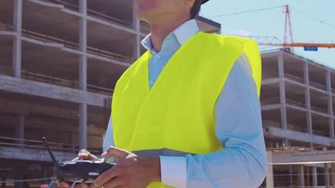 Professional builder standing in front of construction site. Foreman in hardhat Stock Footage 307692532