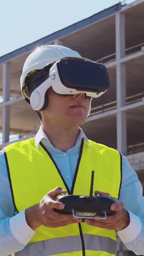 Professional builder standing in front of construction site. Foreman in hardhat Stock Footage 307693361
