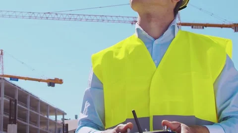 Professional builder standing in front of construction site. Foreman in hardhat Stock Footage 307938357