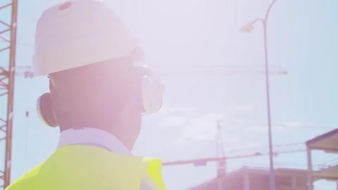 Professional builder standing in front of construction site. Foreman in hardhat Stock Footage 307938801