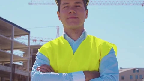 Professional builder standing in front of construction site. Foreman in hardhat Stock Footage 308479305