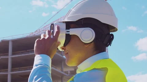 Professional builder standing in front of construction site. Foreman in hardhat Stock Footage 308480061