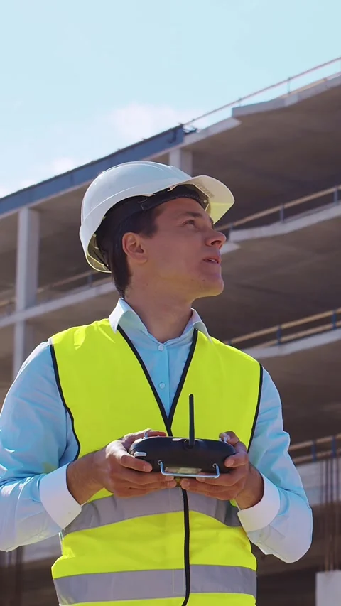 Professional builder standing in front of construction site. Foreman in hardhat Stock Footage 308480189