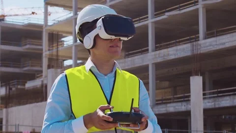 Professional builder standing in front of construction site. Foreman in hardhat Stock Footage 308934502