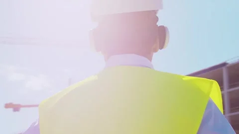 Professional builder standing in front of construction site. Foreman in hardhat Stock Footage 308935260