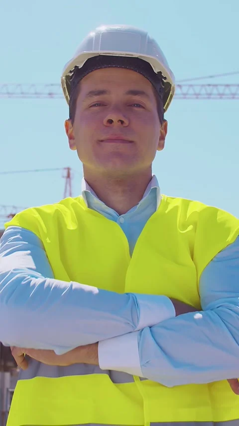 Professional builder standing in front of construction site. Foreman in hardhat Stock Footage 309329673