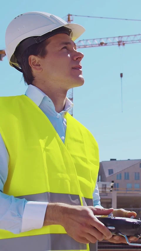 Professional builder standing in front of construction site. Foreman in hardhat Stock Footage 309329809