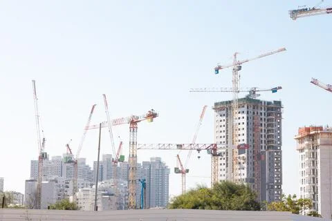 Professional builder standing with notebook in front of the construction site Stock Photos