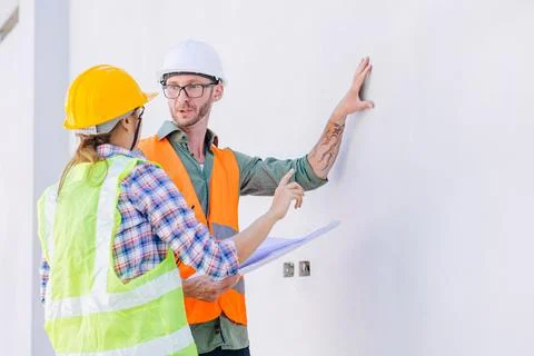 Professional builder team working check progress construction of the wall s.. Stock Photos