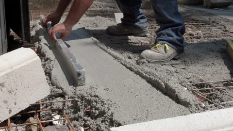 Professional building contractor in dirty clothes and boots using metal Stock Footage 228938148
