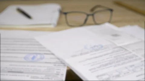 Professional business documents and papers, glasses, pen and copybook Stock Footage 88355086
