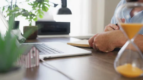 Professional businessman taking notes while reviewing housing information w.. Stock Footage 341624716