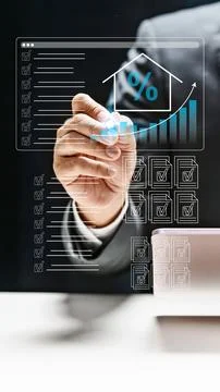 Professional businessman using a digital interface to track real estate mar.. Stock Photos