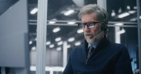 Professional in Call Center Setup, Answering Critical Technical Issues With Stock Footage 325425236