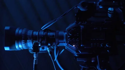 Professional camera with commutation equipment stands on a tripod in news studio Video stock 121660945
