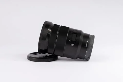 Professional camera lens on white background. Black photography equipment f.. Stock Photos