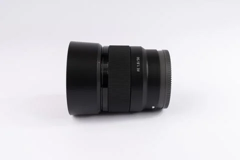 Professional camera lens on white background. Black optical equipment for p.. Stock Photos