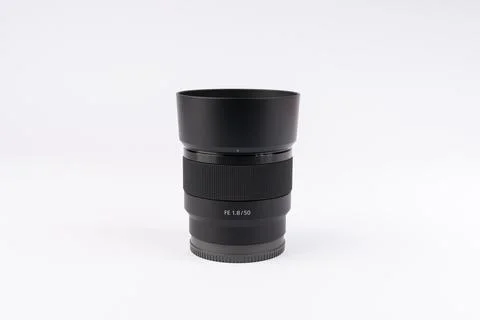 Professional camera lens on white background. Black photography equipment f.. Stock Photos