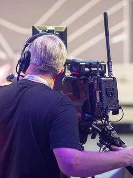 Professional Camera Operator Capturing Live Event Action Stock Photos