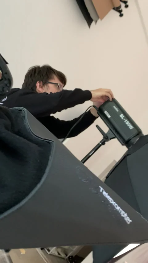 Professional camera operator tests zoom function on camera Video stock 303065058