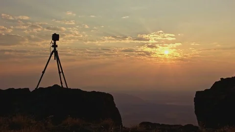 Professional camera silhouette on cliff running timelapse at sunrise Stock Footage 81846013