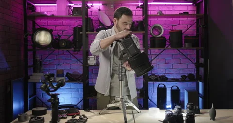 Professional camera video operator shows light setup in a studio. Light for Stock Footage 274364605