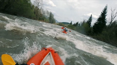 A professional canoeist in a kayak going down the river. Stock Footage 236609839